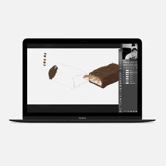 Laptop displaying a digital painting in progress in Adobe Photoshop